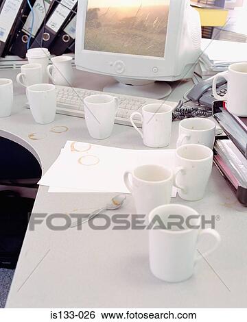 Coffee cups near computer View Large Photo Image Stock Photograph - Coffee cups near computer. Fotosearch