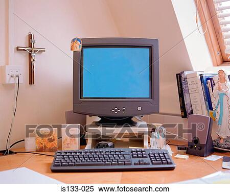 Stock Photography - Crucifix and personal computer. Fotosearch