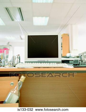 Empty whiskey bottle near computer View Large Photo Image Stock Image - Empty whiskey bottle near computer. Fotosearch