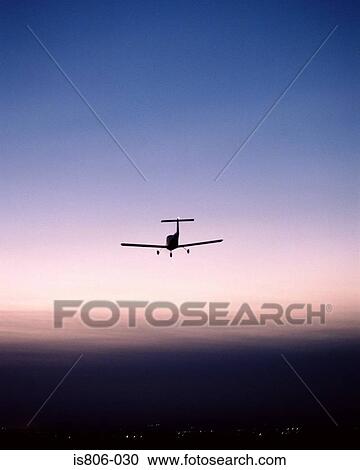 Monoplane flying in sunset View Large Photo Image Stock Image - Monoplane flying in sunset. Fotosearch