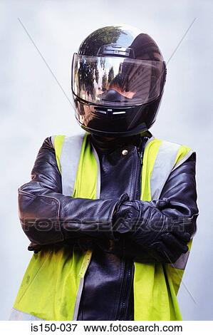 Motorcyclist wearing crash helmet View Large Photo Image Stock Photo - Motorcyclist wearing crash helmet. Fotosearch