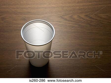 Stock Photograph - Plastic cup on desk. Fotosearch