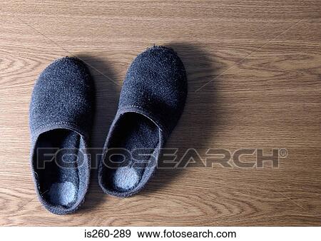 Stock Photo - Slippers on wooden floor. Fotosearch