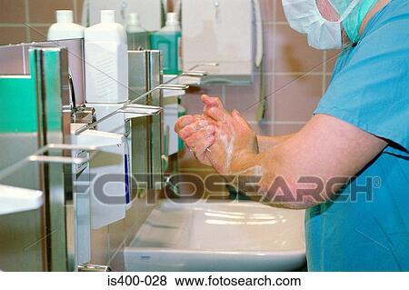 Surgical staff washing hands View Large Photo Image Stock Photo - Surgical staff washing hands. Fotosearch