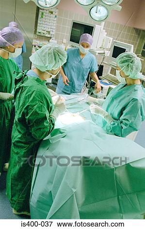 Surgical team at work View Large Photo Image Stock Photo - Surgical team at work. Fotosearch