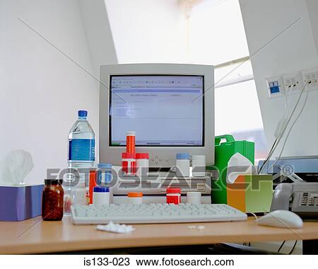 Vitamin pills around computer View Large Photo Image Stock Image - Vitamin pills around computer. Fotosearch