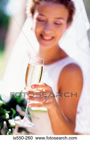 Bride having champagne View Large Photo Image Stock Image - Bride having champagne. Fotosearch