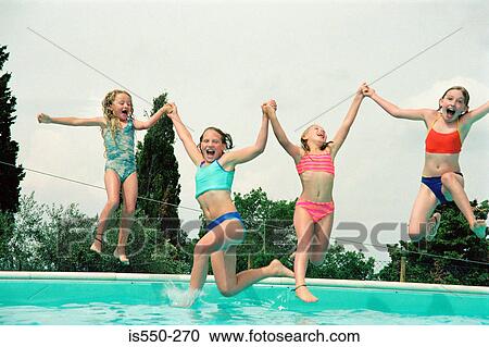 Stock Image - Girls playing at the pool. Fotosearch