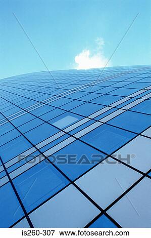 Stock Photo - Sheer face of glass skyscraper. Fotosearch