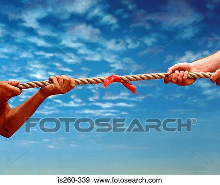Two men play tug ofwar View Large Photo Image Stock Photo - Two men play tug ofwar. Fotosearch