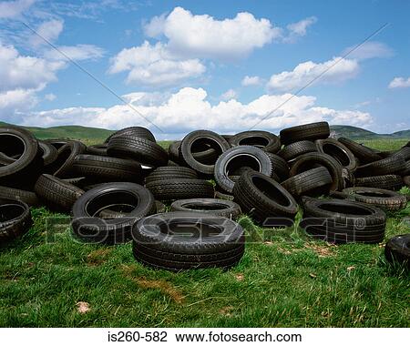 Tyres dumped in countryside View Large Photo Image Stock Image - Tyres dumped in countryside. Fotosearch