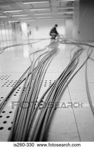 Workman with cables indoors View Large Photo Image Stock Image - Workman with cables indoors. Fotosearch