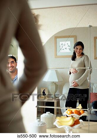 Couple happily expecting baby View Large Photo Image Stock Image - Couple happily expecting baby. Fotosearch
