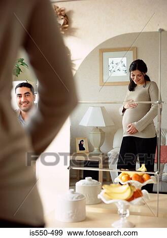 Stock Photo - Couple happily expecting baby. Fotosearch