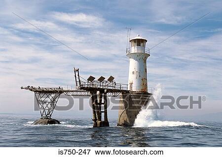 Lighthouse cut off by the sea View Large Photo Image Stock Photo - Lighthouse cut off by the sea. Fotosearch
