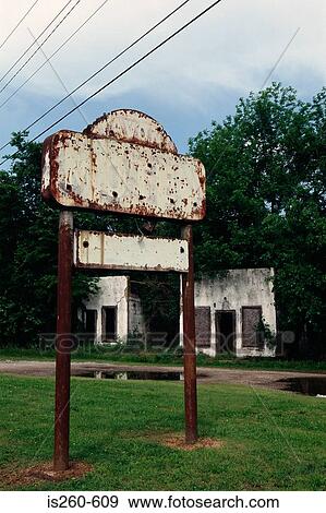 Worn out sign in rundown area View Large Photo Image Stock Photo - Worn out sign in rundown area. Fotosearch