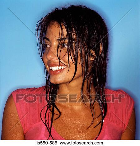 Stock Photograph - Portrait of smiling hispanic woman. Fotosearch