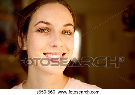 Portrait of smiling young woman View Large Photo Image Stock Image - Portrait of smiling young woman. Fotosearch