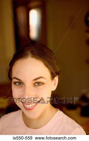 Stock Photo - Portrait of smiling young woman. Fotosearch