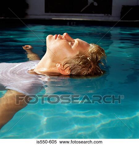 Stock Photography - Young woman in swimming pool. Fotosearch