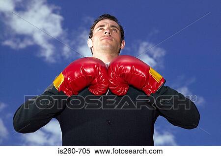 Businessman wearing boxing gloves View Large Photo Image Stock Photography - Businessman wearing boxing gloves. Fotosearch
