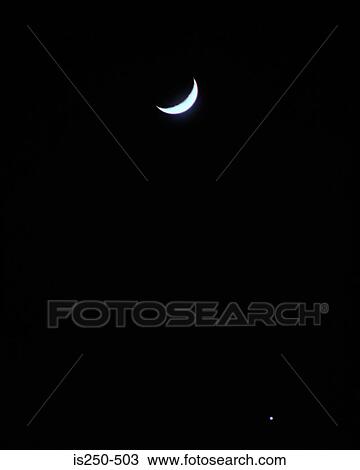 Stock Image - Crescent moon in sky. Fotosearch