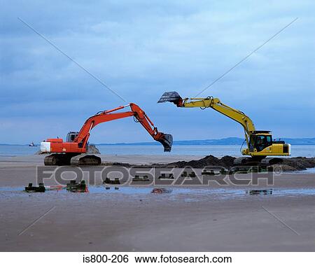 Earth movers on beach View Large Photo Image Stock Photograph - Earth movers on beach. Fotosearch