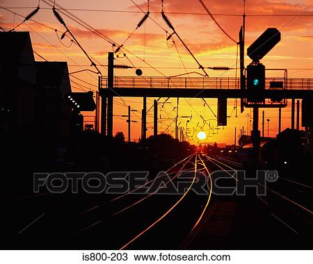 Empty railroad tracks at sunset View Large Photo Image Stock Image - Empty railroad tracks at sunset. Fotosearch