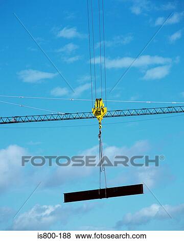 Industrial crane holding a girder View Large Photo Image Stock Photo - Industrial crane holding a girder. Fotosearch