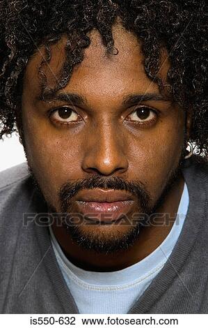 Portrait of a hostile looking man View Large Photo Image Stock Image - Portrait of a hostile looking man. Fotosearch