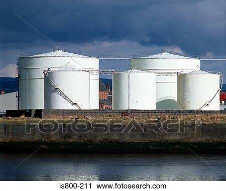 Stock Image - Silos near a river. Fotosearch