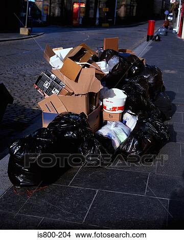 Stack of bin bags on street View Large Photo Image Picture - Stack of bin bags on street. Fotosearch