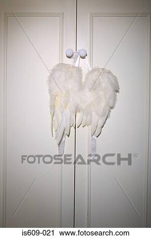 Angel wings in wardrobe door View Large Photo Image Stock Image - Angel wings in wardrobe door. Fotosearch