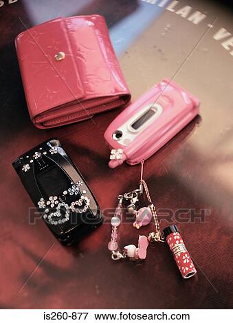 Cellular telephone and purse View Large Photo Image Stock Photo - Cellular telephone and purse. Fotosearch
