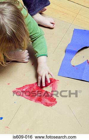 Stock Photograph - Girl painting a heart shape. Fotosearch