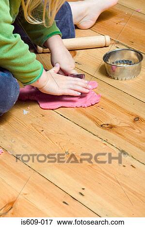 Stock Photo - Girl playing with plasticine. Fotosearch