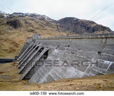 Stock Photo - Large dam near hill. Fotosearch