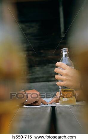 Mapping the route with a drink. View Large Photo Image Stock Photography - Mapping the route with a drink.. Fotosearch