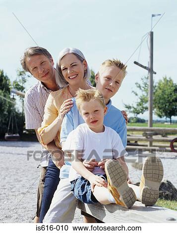 Stock Image - Portrait of family outdoors.. Fotosearch
