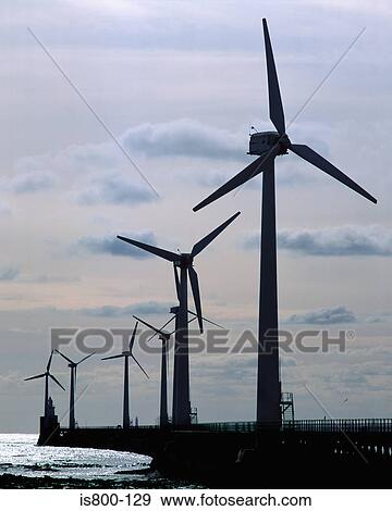 Stock Photo - Wind farm on beach. Fotosearch
