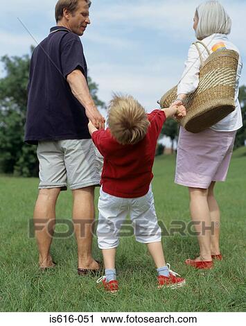 Young boy and parents outside. View Large Photo Image Stock Image - Young boy and parents outside.. Fotosearch