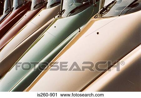 Stock Image - A row of vintage automobile hoods. Fotosearch