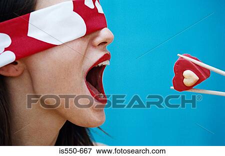 Blindfolded woman being fed View Large Photo Image Stock Photo - Blindfolded woman being fed. Fotosearch