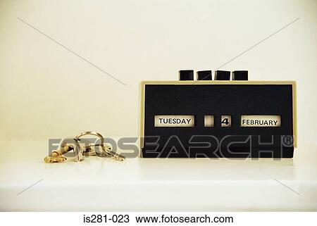 Stock Image - Keys and retro calendar. Fotosearch