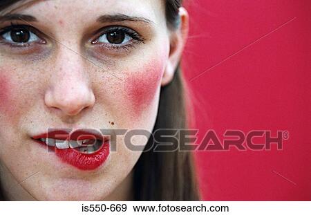 Woman biting her lip View Large Photo Image Stock Photo - Woman biting her lip. Fotosearch