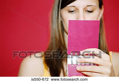 Woman reading notebook View Large Photo Image Stock Image - Woman reading notebook. Fotosearch
