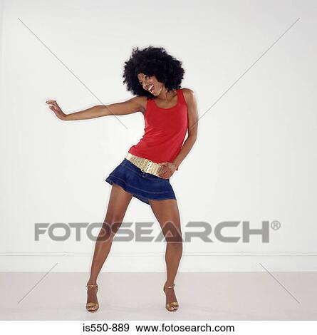 Woman with afro dancing View Large Photo Image Stock Photo - Woman with afro dancing. Fotosearch
