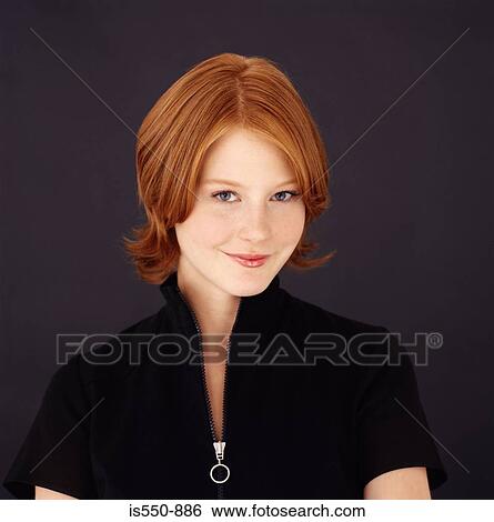 Stock Photograph - Young red-headed woman. Fotosearch