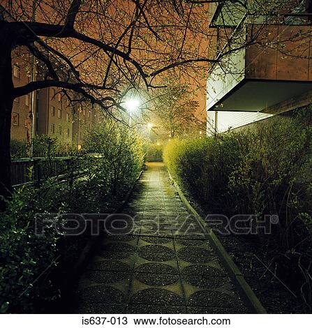 A path between apartment blocks View Large Photo Image Stock Image - A path between apartment blocks . Fotosearch