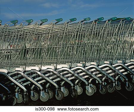 Stock Photo - A row of supermarket trolleys. Fotosearch